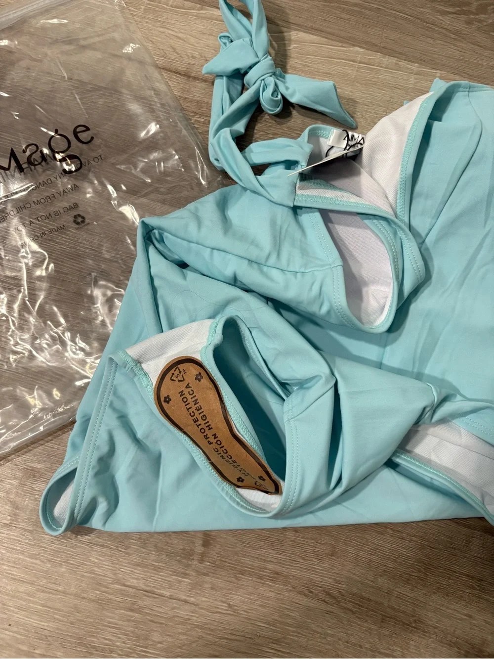 NWT Light Blue Belted One-Piece Swimsuit. Womens size medium